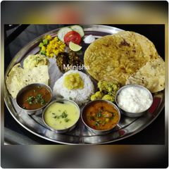 A picture of Maharashtratrian Puranpoli Thali.