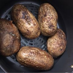 A picture of Air Fryer Baked Potato Baked Garlic Parsley Potatoes.