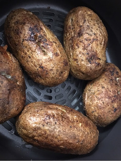 A picture of Air Fryer Baked Potato Baked Garlic Parsley Potatoes.