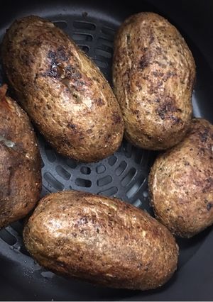 A picture of Air Fryer Baked Potato Baked Garlic Parsley Potatoes.