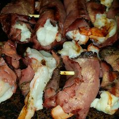 A picture of Brad's pastrami wrapped coconut prawn skewers.