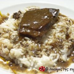 A picture of Beef liver with orange sauce.