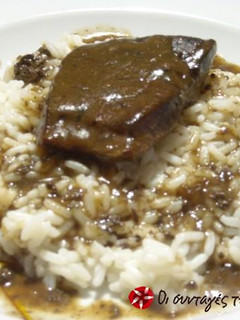 A picture of Beef liver with orange sauce.