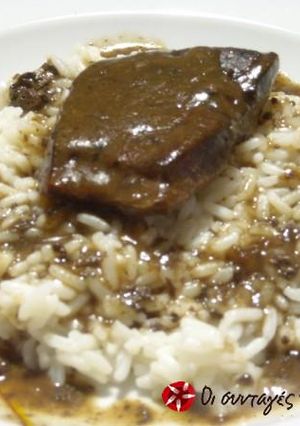 A picture of Beef liver with orange sauce.