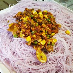 A picture of Rice Noodles with veggies.