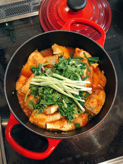 A picture of Tofu in tomato sauce.