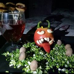 A picture of Dents De vampire with glass of blood.