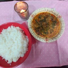 A picture of Fish curry with boil rice.