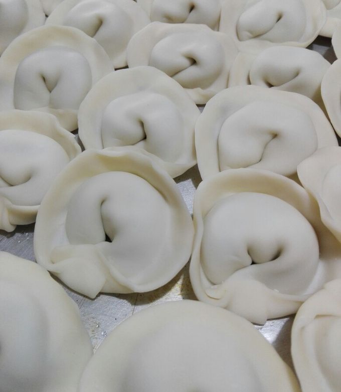 Una foto de Agnolotti de acelga y pollo