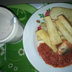 A picture of Fried yam with fish stew.
