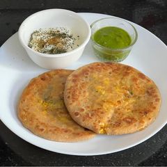 A picture of Boiled Corn 🌽 Cheese 🧀 Barley Flour Paratha 🫓.