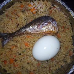 A picture of Garnished jollof rice.