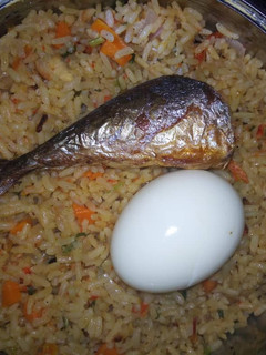 A picture of Garnished jollof rice.
