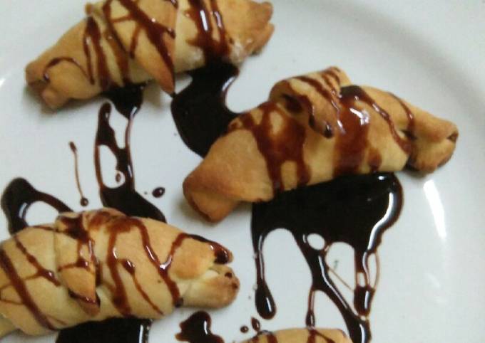 Stuffed dry fruits coconut Croissants drizzled with chocolate sy