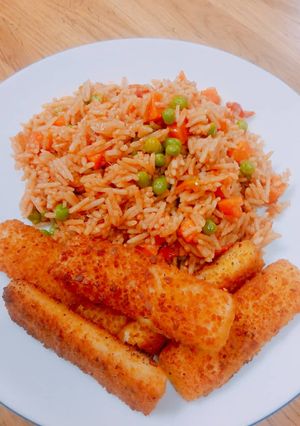 A picture of Simple jollof rice with crispy fish finger.