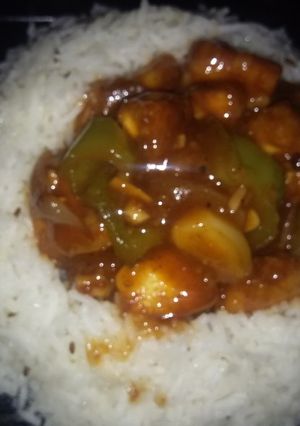 A picture of Chilli paneer with jeera rice.