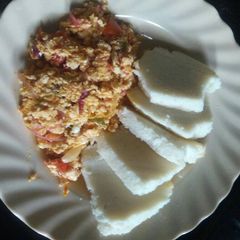 A picture of Home made ugali with eggs.