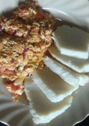 A picture of Home made ugali with eggs.