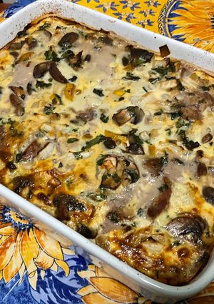 Une photo de Flan aux champignons, magret de canard et courgette