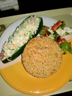 A picture of Cucumber Boat with chicken kebab.