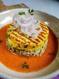 Paneer Steak on spinach rice with makhani gravy