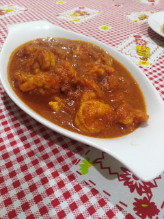Una foto de Langostinos entomatados