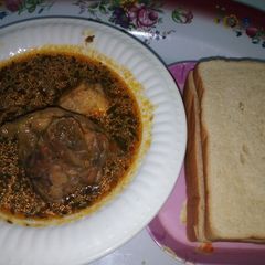 A picture of Bread with Turkey Pepper Soup.