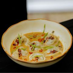 A picture of Coconut-Infused Beef Dumpling Soup.