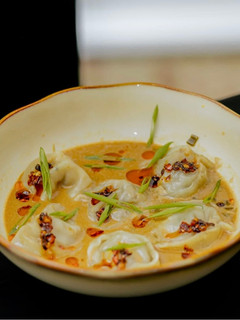 A picture of Coconut-Infused Beef Dumpling Soup.