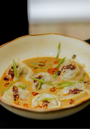 A picture of Coconut-Infused Beef Dumpling Soup.