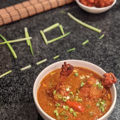 A picture of Chicken lollipop Schezwan Gravy.