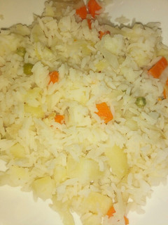 A picture of White rice with veggies.