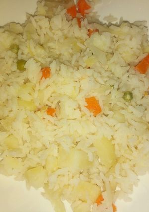 A picture of White rice with veggies.