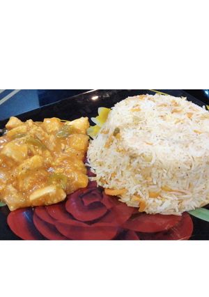 A picture of Egg fried rice with Manchurian.