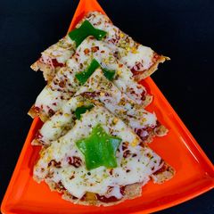 A picture of Bhakri pizza whole wheat thin crust pizza.