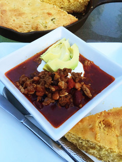 A picture of Three Bean Chili with Cornbread.