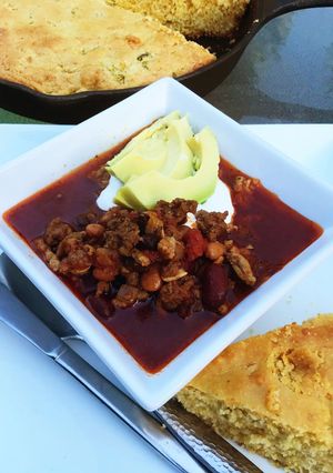 A picture of Three Bean Chili with Cornbread.