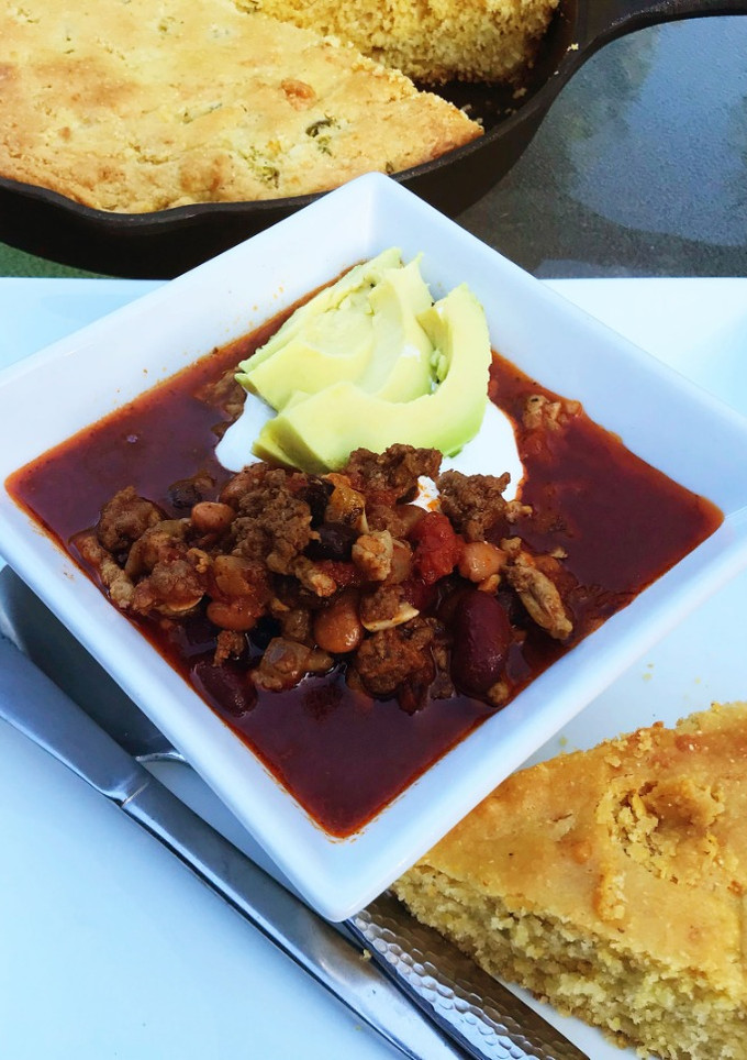 A picture of Three Bean Chili with Cornbread.