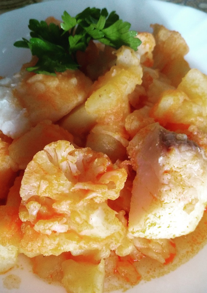 Una foto de Bacalao con coliflor y patatas