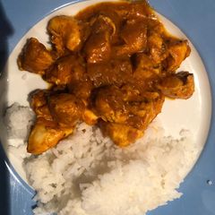 A picture of Chicken curry and rice.