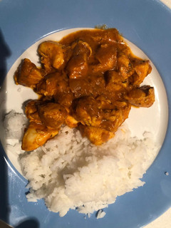 A picture of Chicken curry and rice.