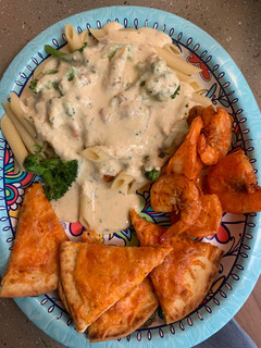 A picture of Bobby&Whittney”s Homemade Penne Chicken Alfredo with broccoli and shrimp.