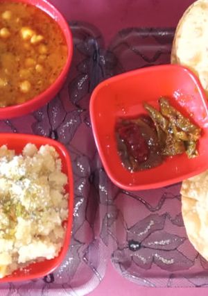 A picture of Chick peas potato halwa poori.