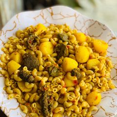 A picture of Macaroni jollof with potatoes.