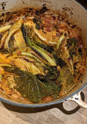 A picture of Caramelised Savoy cabbage with tomato and beans.