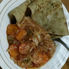 A picture of Chapati with spiced cabbages.