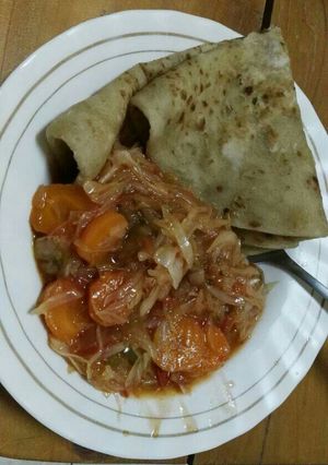 A picture of Chapati with spiced cabbages.