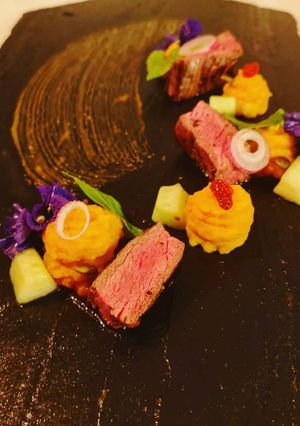 A picture of Steak served with sweet potatoes.