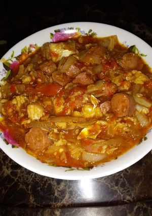 A picture of Fish and sausage sauce.