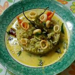 Mango kadhi with green pulao A picture of Mango kadhi with green pulao.